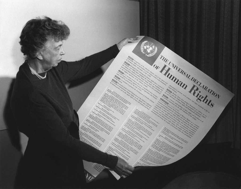 Eleanor Roosevelt holding the poster version of the United Nations Universal Declaration of Human Rights (1948).